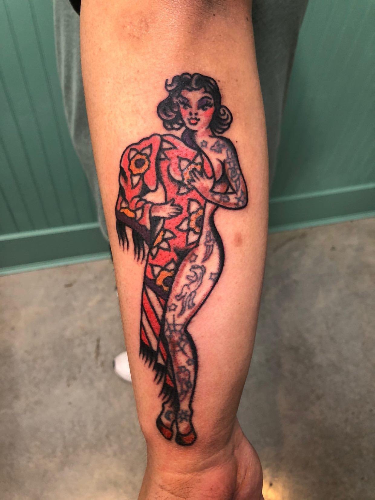 Old-school pin-up girl tattoo