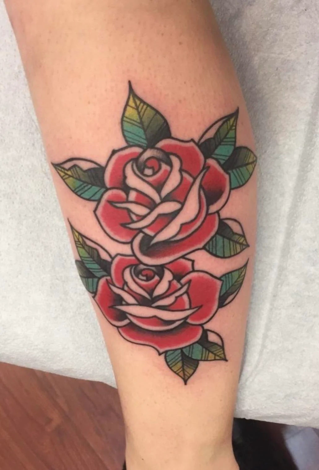 Traditional American rose tattoo by All About It Ink